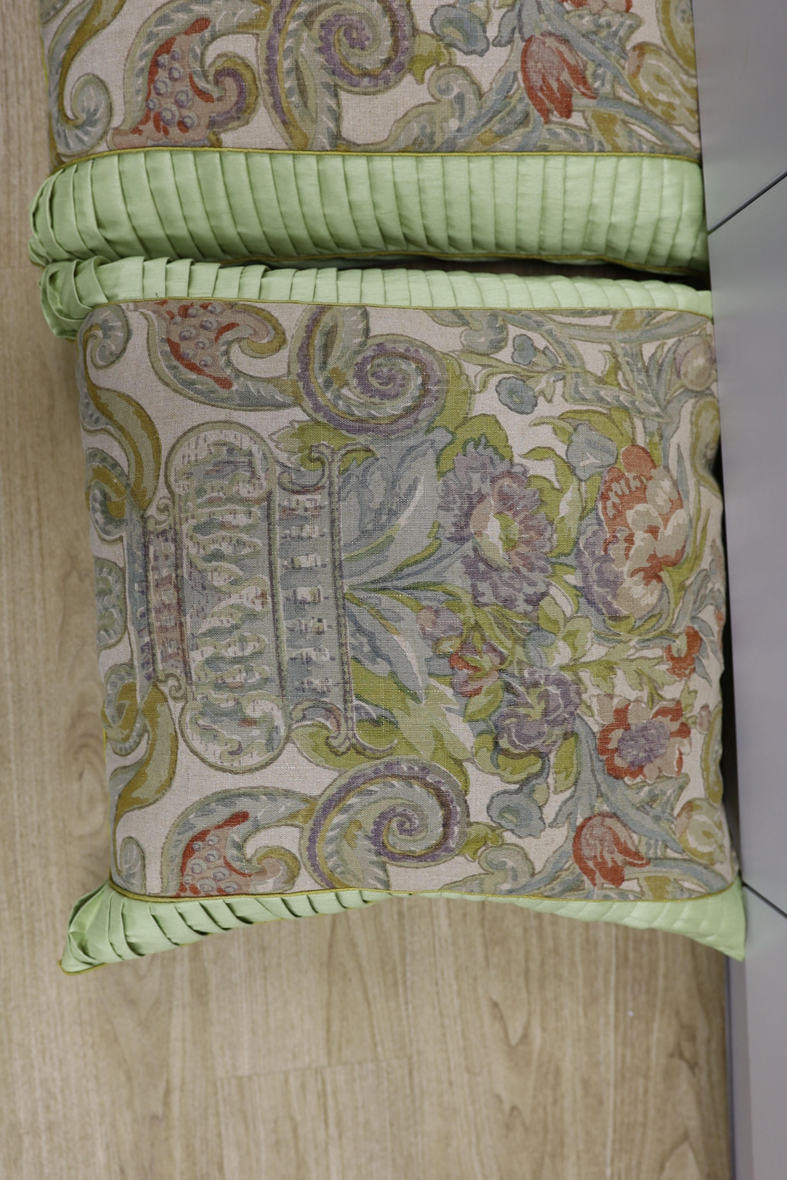 A pair of large fabric cushions